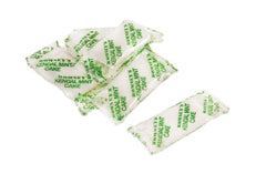 A pile of White Kendal Mint Cake individually wrapped in a transparent wrapper.