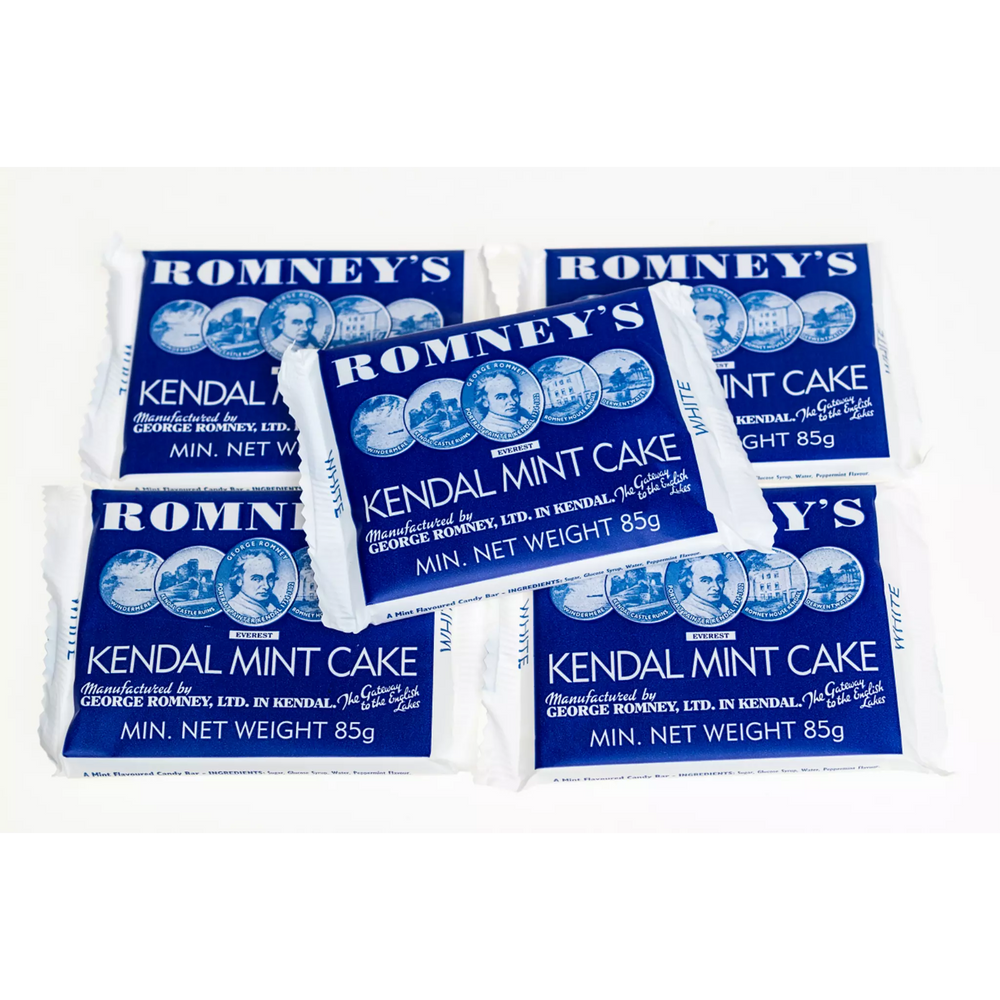Five 85g bars of Romney's White Kendal Mint Cake which is in a blue and white wrapper. The wrapper features the Romney's logo and the words 'Romney's Kendal Mint Cake' in a white font.