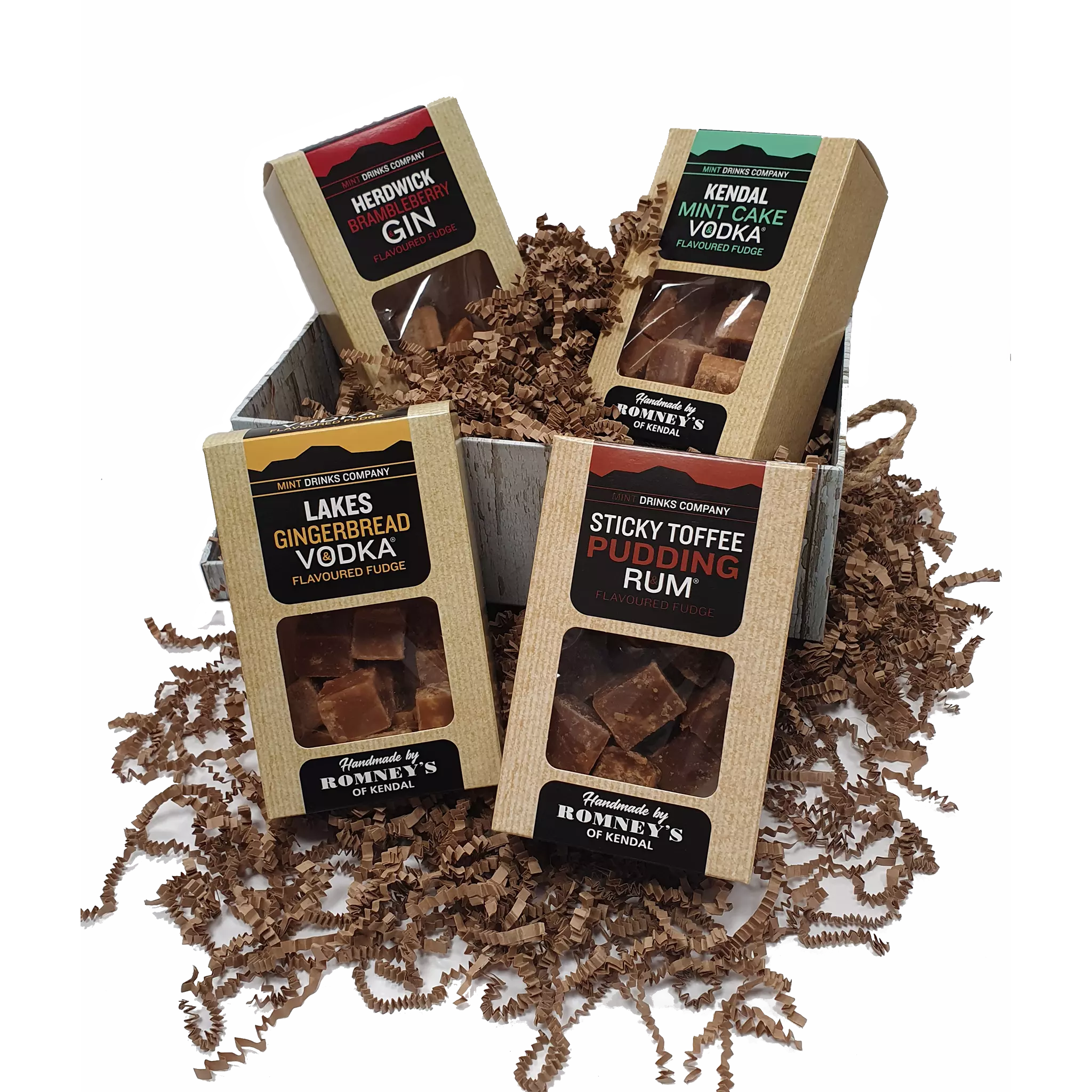 An open whitewash effect gift box bursting with 4 fudge boxes. The fudge box flavours are: Herdwick Brambleberry Gin, Kendal Mint Cake Vodka, Lakes Gingerbread Vodka & Sticky Toffee Pudding Rum.