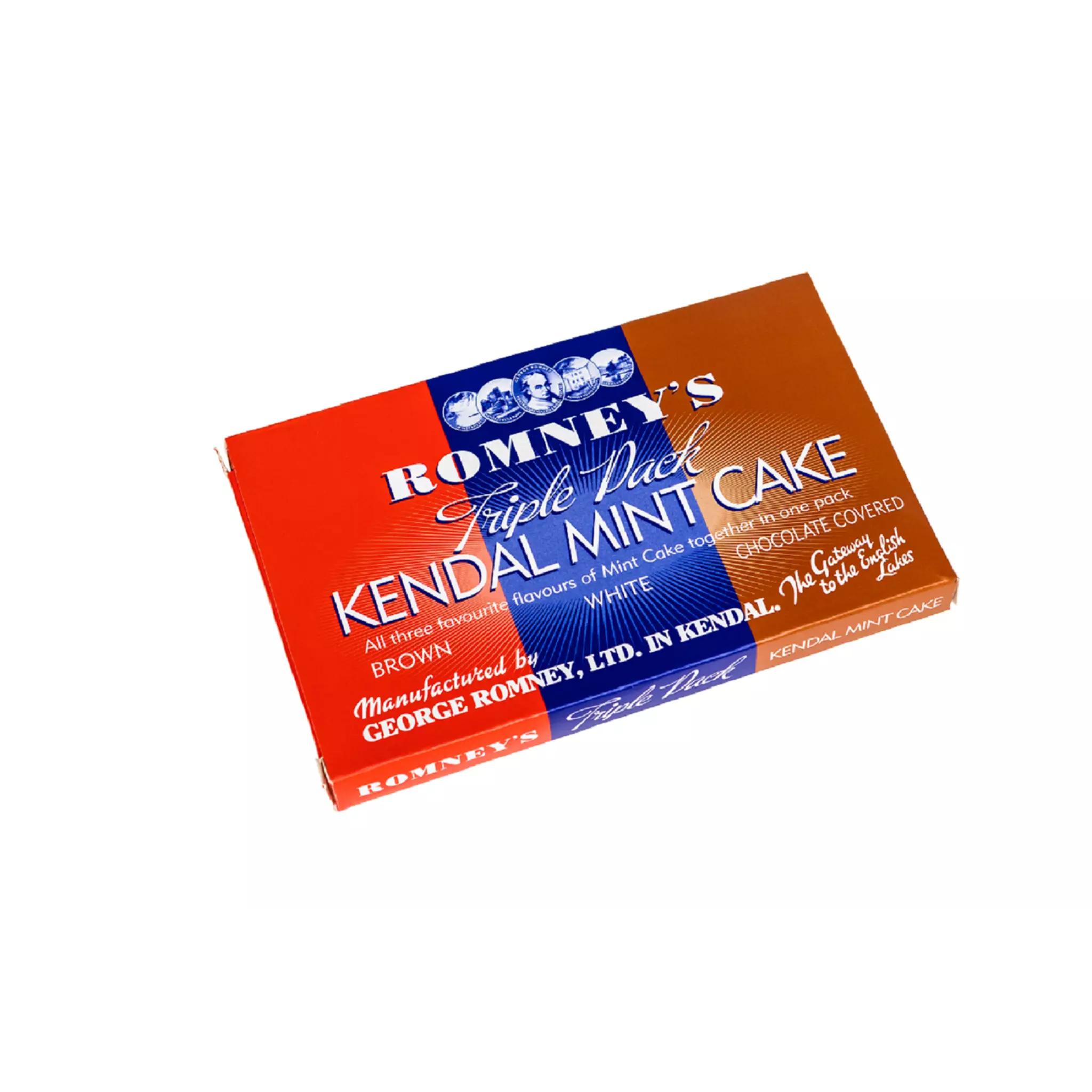 A rectangular cardboard box containing three bars of Kendal Mint Cake. The box is split into three different colours, red on the left, blue in the middle and brown on the right. The box features the Romney's logo and words 'Romney's triple pack Kendal Mint Cake' in a white font.