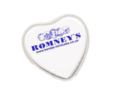 A heart shaped silver tin featuring the Romney's logo in blue with the word 'Romney's' and web address www.kendal.mintcake.co.uk