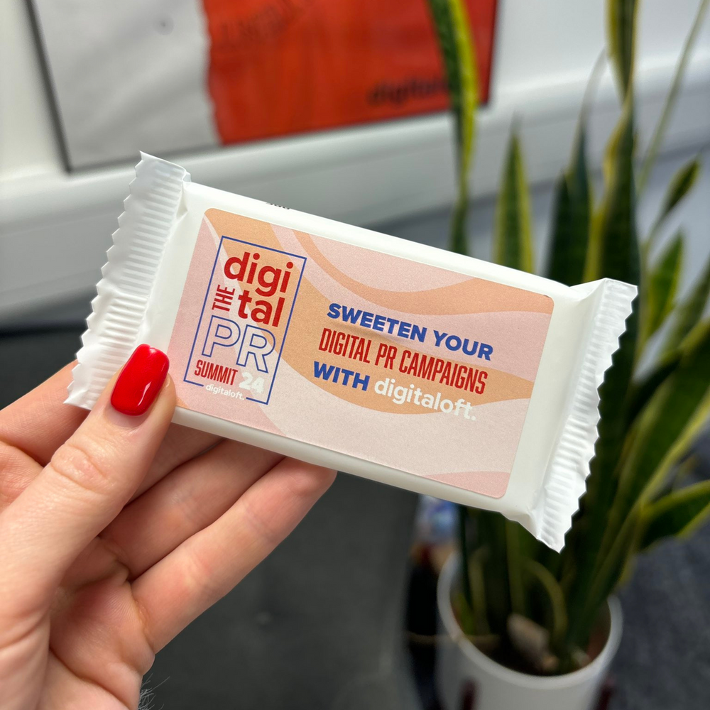 a bar of Kendal Mint Cake in a plain white wrapper. The bar has a label covering the front bespoke to the company Digitaloft