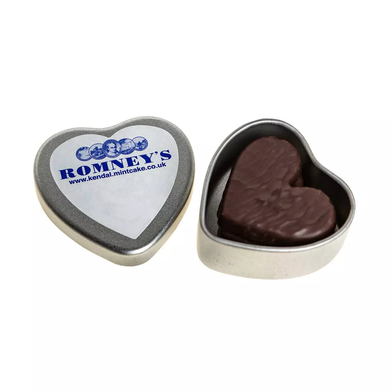 A heart shaped tin is open on the right of the image and contains a heart shaped chocolate coated Kendal Mint Cake. The lid is to the right of the image and has a white heart shaped sticker on it featuring the text 'Romney's'. the website URL & Romney's logos in a blue font.