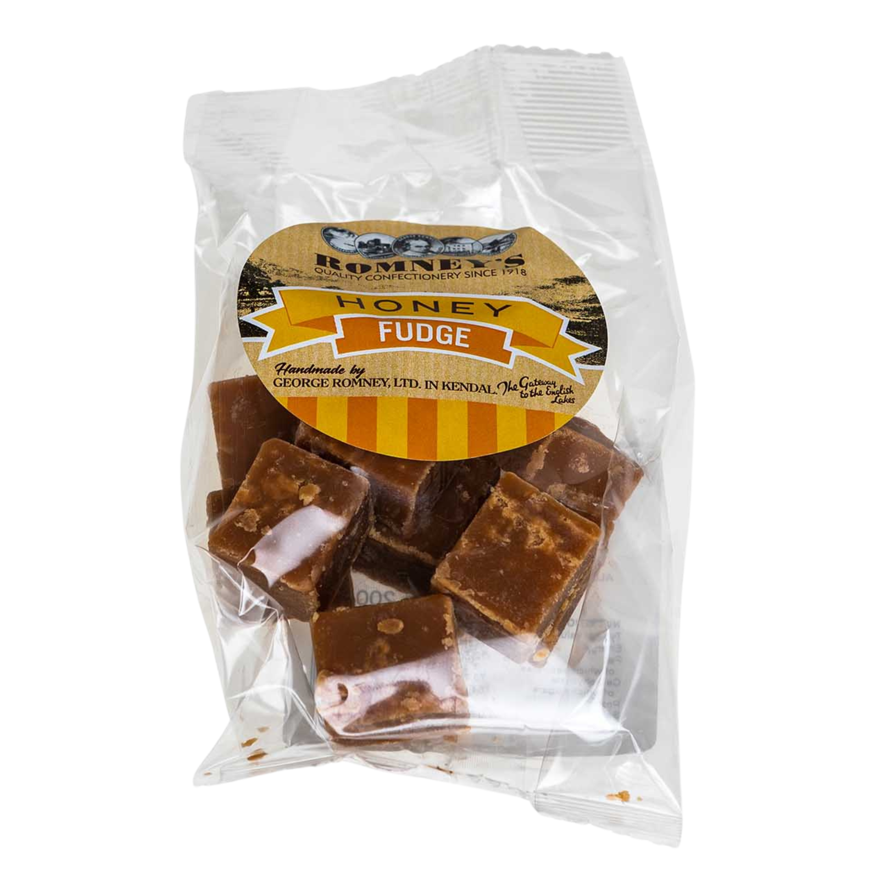 A transparent bag containing pieces of Fudge. The bag has a label on it that shows Romney's logo and says 'Honey Fudge'.