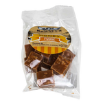 A transparent bag containing pieces of Fudge. The bag has a label on it that shows Romney's logo and says 'Honey Fudge'.