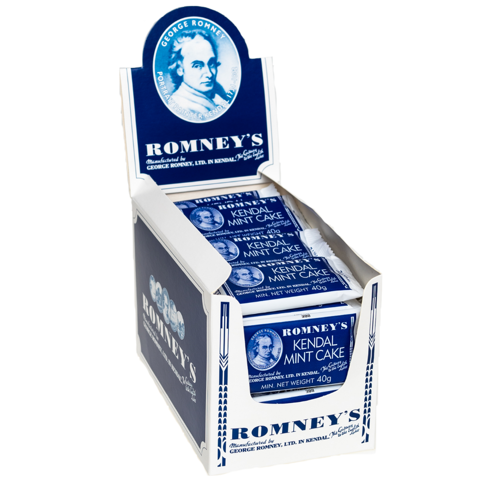 A product image showing an open cardboard box which is used to display products on a shelf and is white and blue. The box contains 40g bars of Romney's White Kendal Mint Cake which is in a blue and white wrapper.