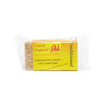 A wrapped bar of traditional flapjack with a yellow and orange label.