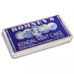A rectangular silver tin with a blue lid that has the Romney's logo embossed onto it along with the words 'Romney's Kendal Mint Cake'.