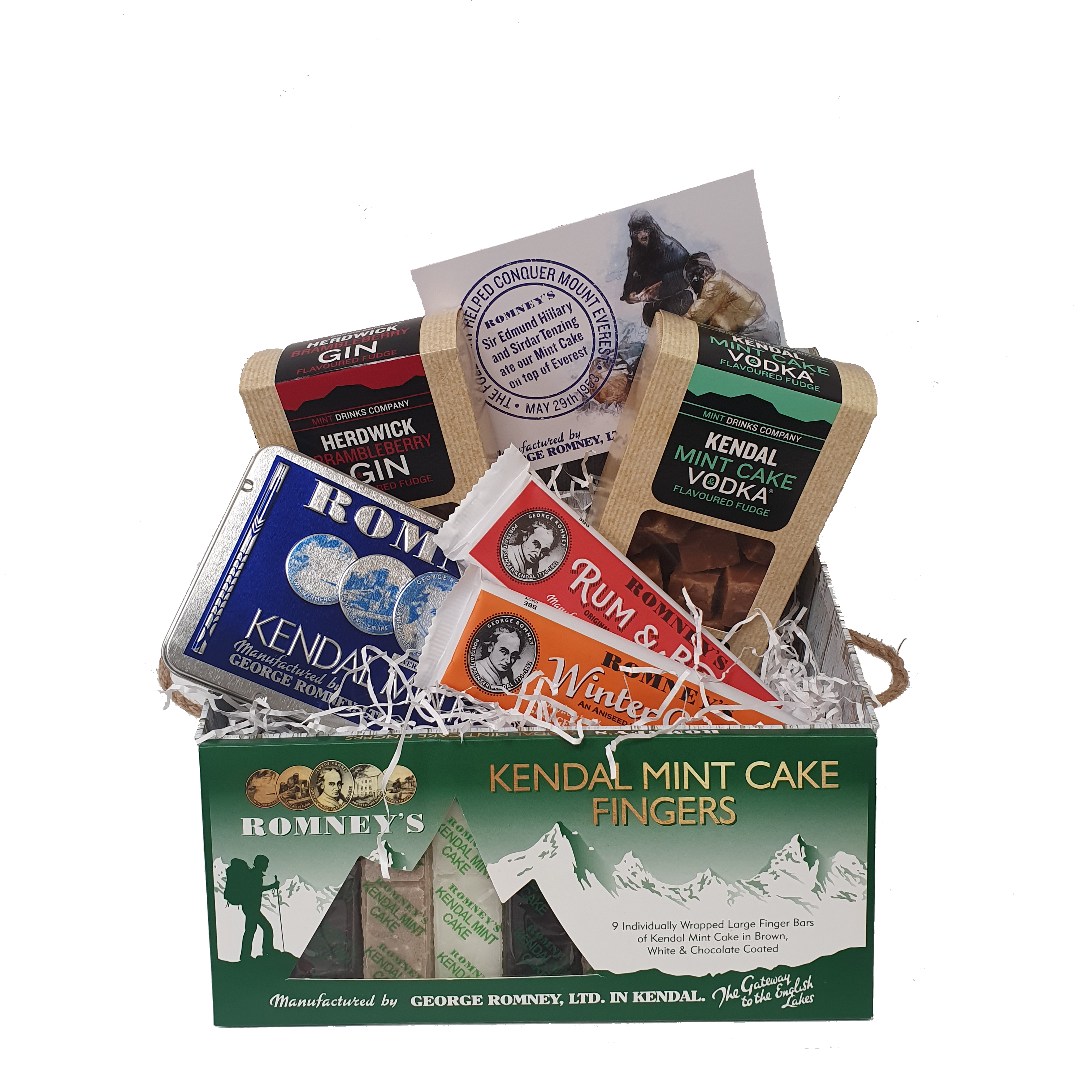 An open whitewash effect giftbox with confectionery products inside. It includes 2 fudge boxes, a Romney's traditional Mint Cake Tin, a Rum & Butter Candy Bar, a Winter Candy Bar & a Kendal Mint Cake Fingers Box
