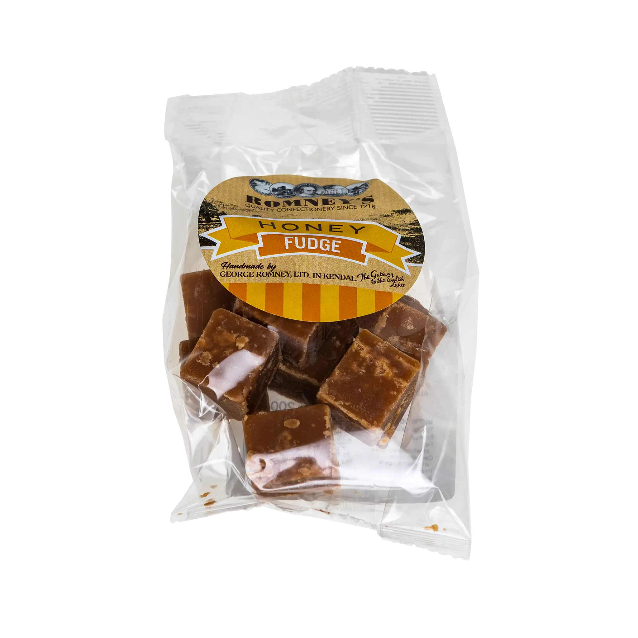 A transparent bag containing pieces of Fudge. The bag has a label on it that shows Romney's logo and says 'Honey Fudge'.