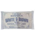 A paper wrapper containing a bar of White Kendal Mint Cake and a bar of Brown Kendal Mint Cake. The wrapper features the Romney's logo with the writing 'White & Brown Kendal Mint Cake' in a blue font.