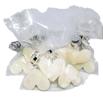 three transparent bags each containing three white kendal mint cake pieces in the shape of a heart. the bags are tied with a silver ribbon
