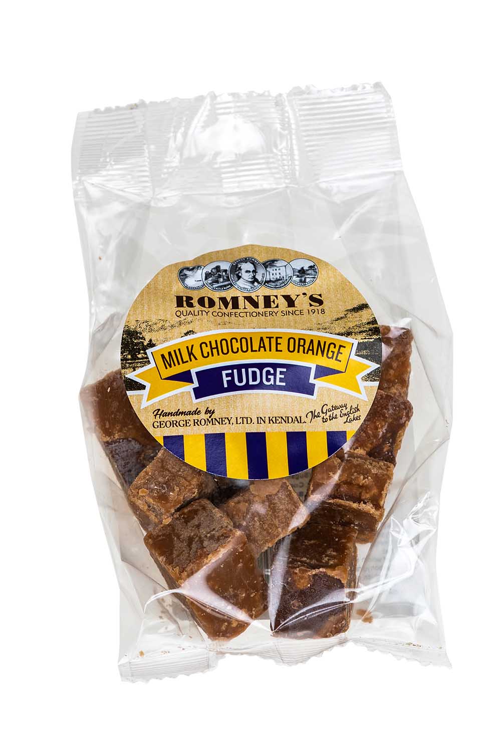 A transparent bag containing pieces of Fudge. The bag has a label on it that shows Romney's logo and says 'Milk Chocolate Orange Fudge'